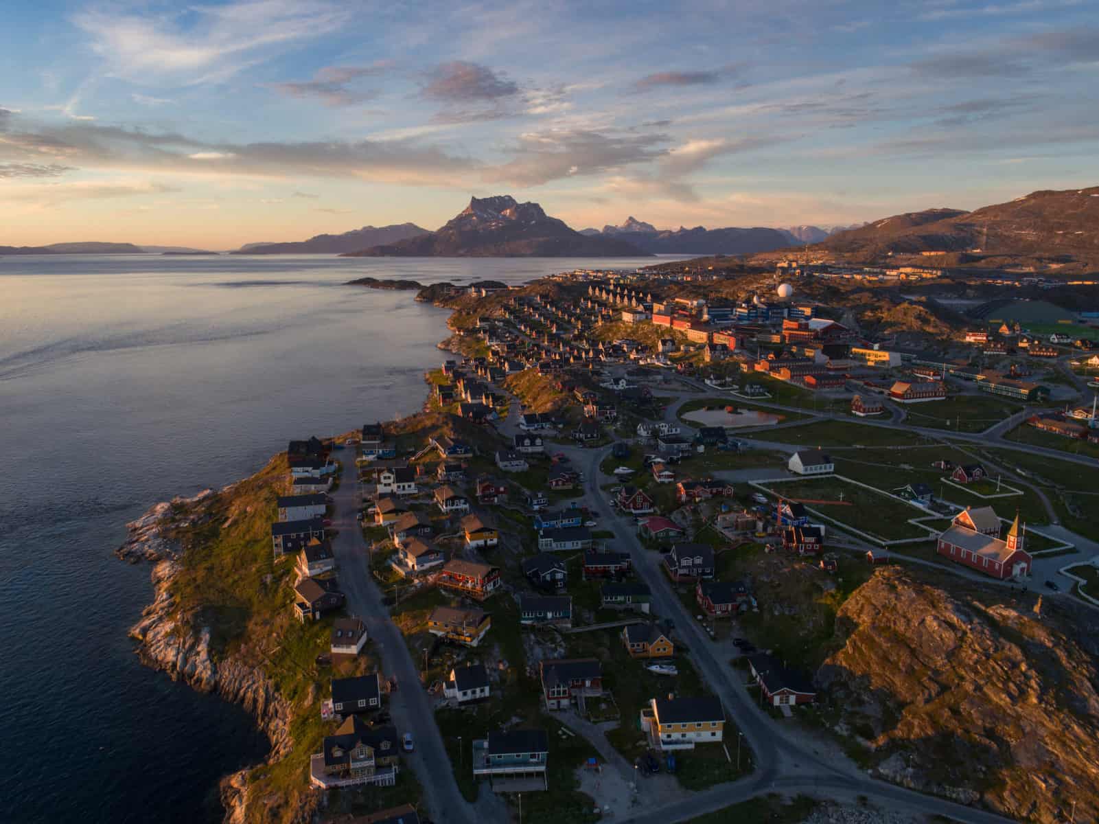 Aerial of Nuuk and Sermitsiaq mountain at sunset