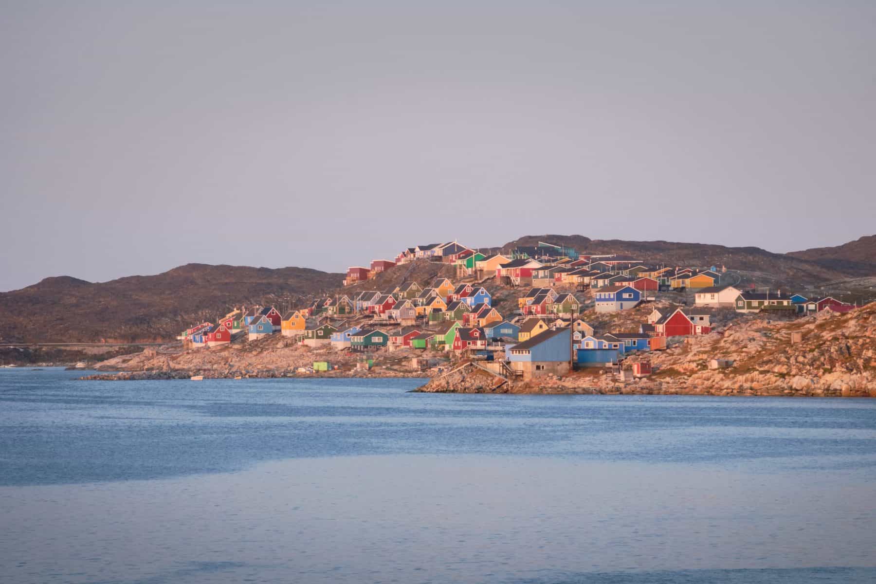 The colourful houses of Aasiaat line the shores of Disko Bay
