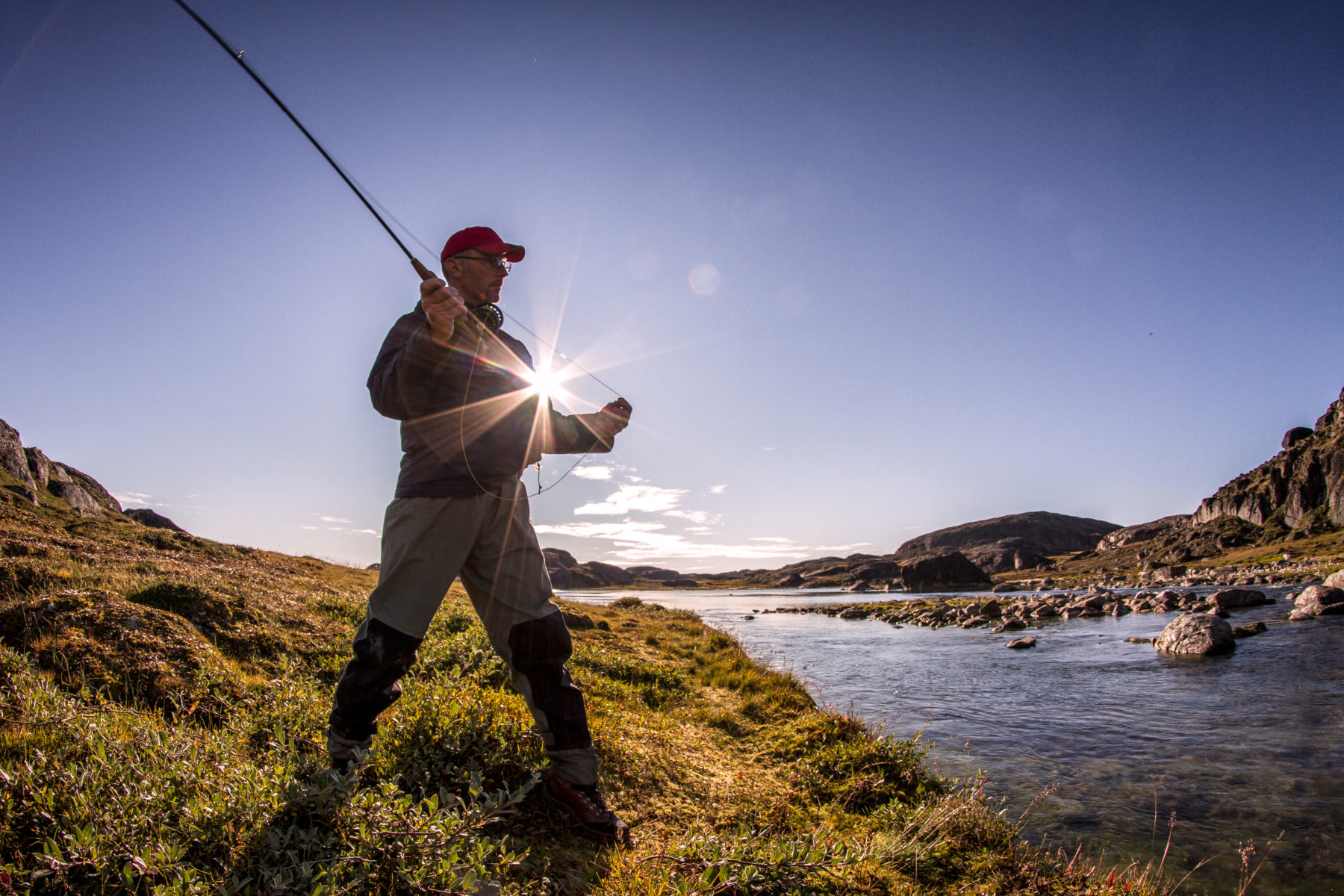 Person fishing one of the pristine rivers near Sisimiut