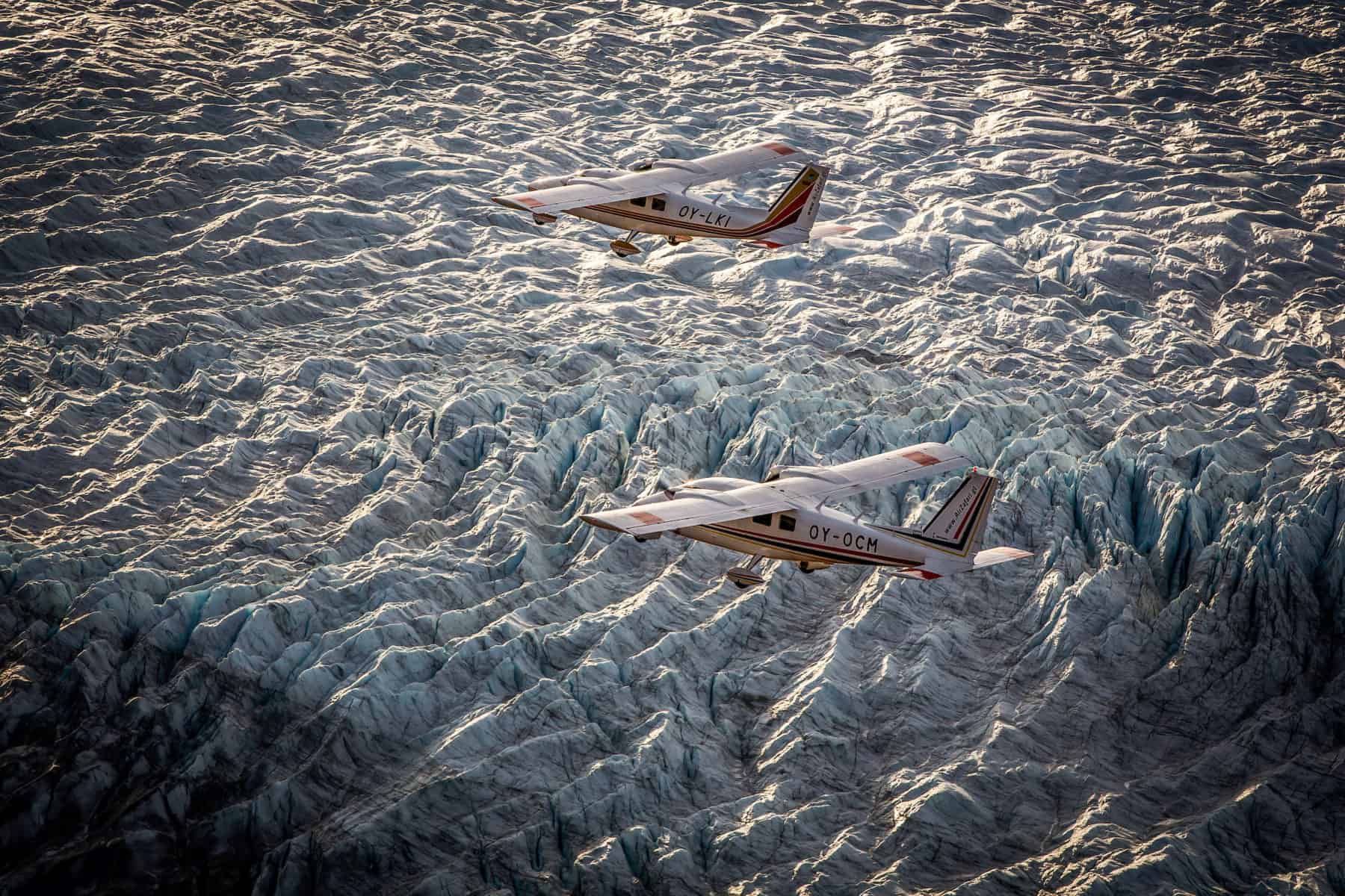 Two planes on a scenic flight over the enormous Greenlandic Icesheet near Kangerlussuaq
