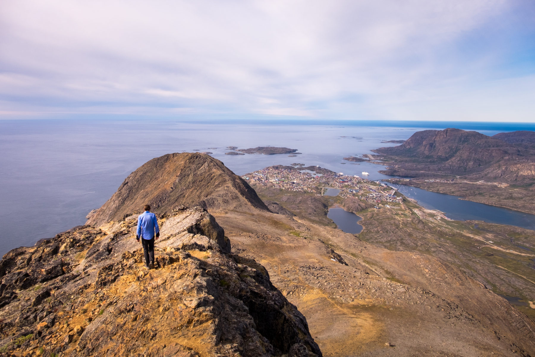 Hiker at the summit of Nasaasaaq Peak near Sisimiut - a great trail extension option for the Arctic Circle Trail