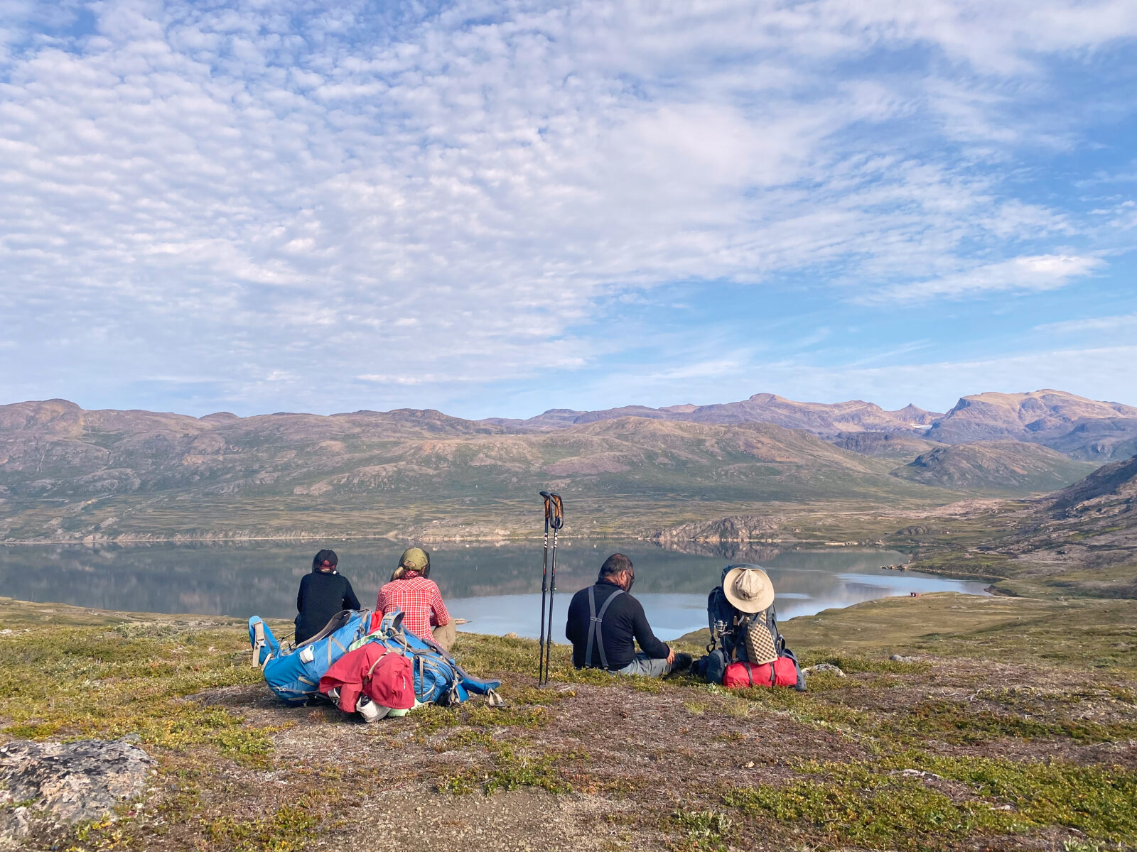 Hikers enjoying lunch overlooking one of the Arctic Circle Trail's many lakes
