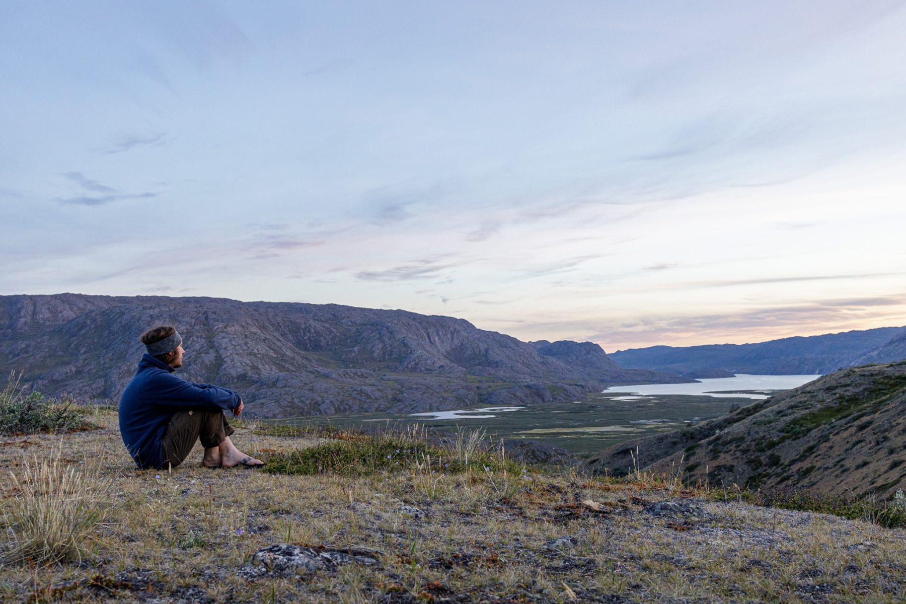 Person overlooking the Itinneq River Valley on the Arctic Circle trail, west Greenland
